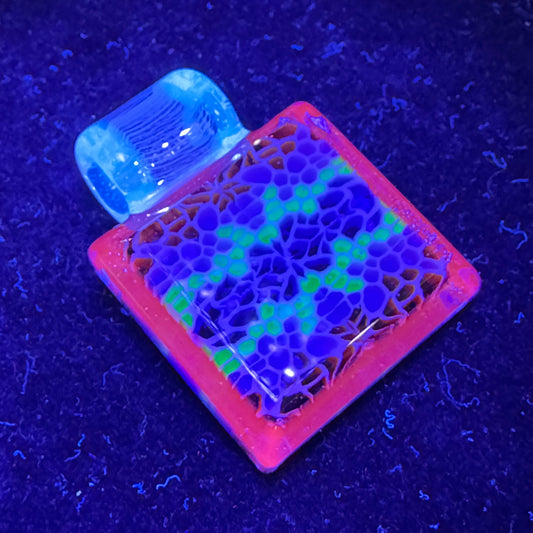 Murrine chip stack cold worked blown glass pendant with hidden UV reactive colors