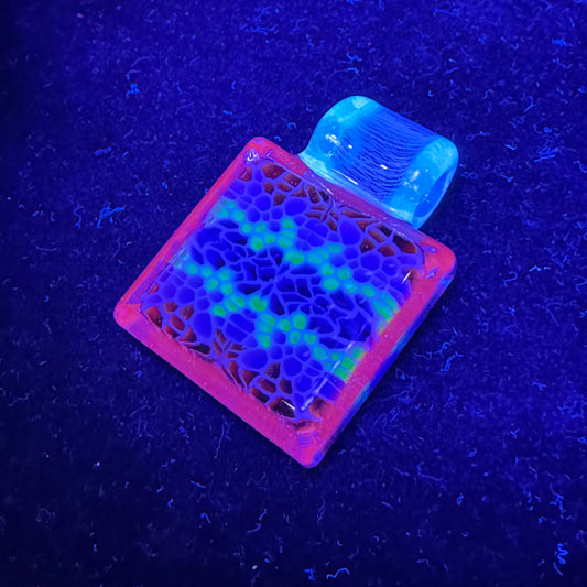 Murrine chip stack cold worked blown glass pendant with hidden UV reactive colors