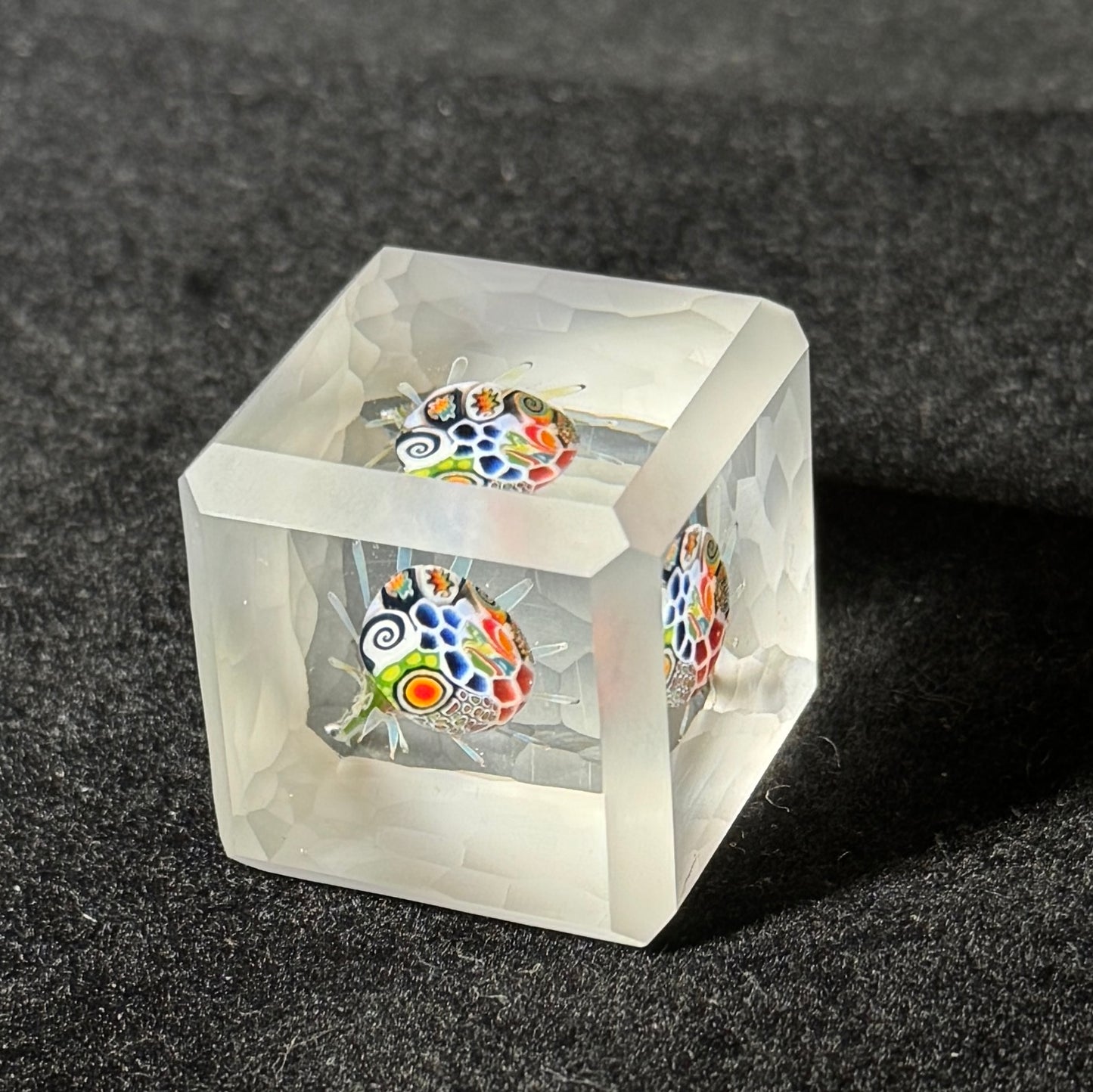 cold worked battuto cut glass cube with murrini implosion by Hefe Glass Remy