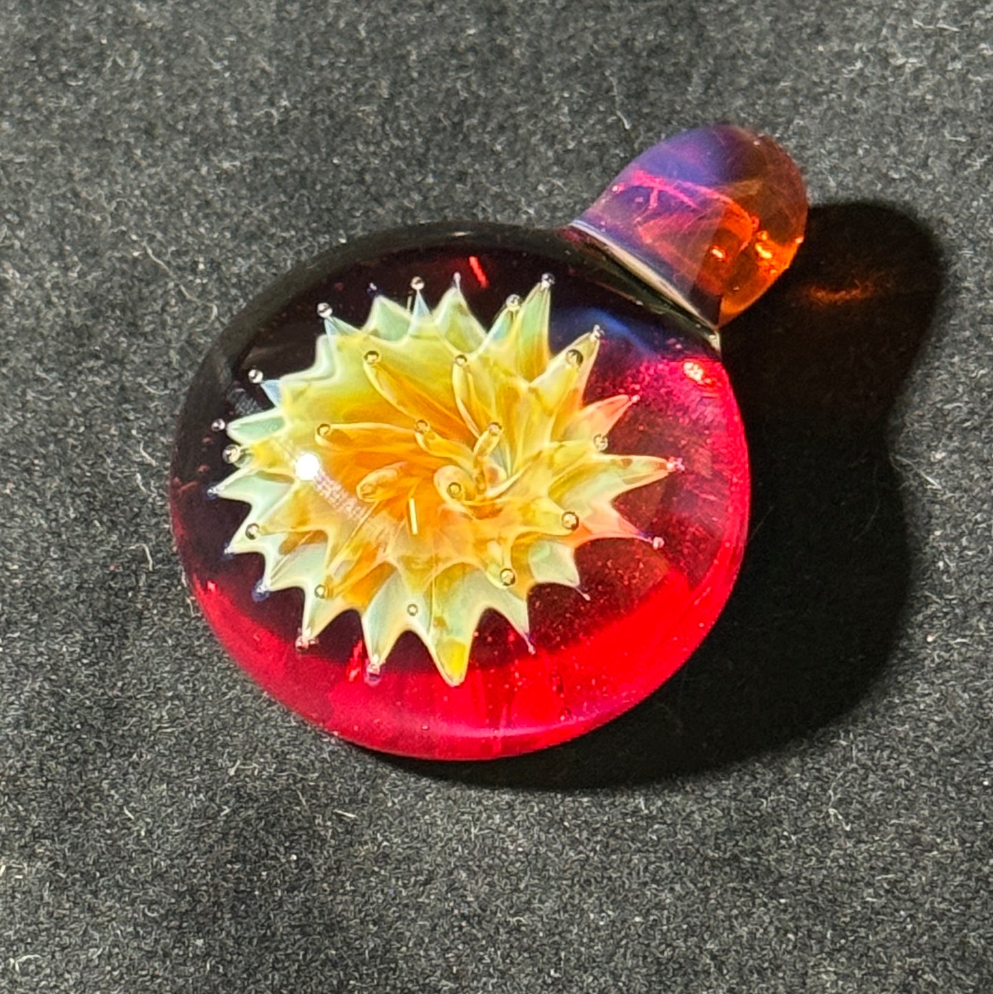 Air trap amberpurple blast implosion pendant, amberpurple bale and phoenix backing