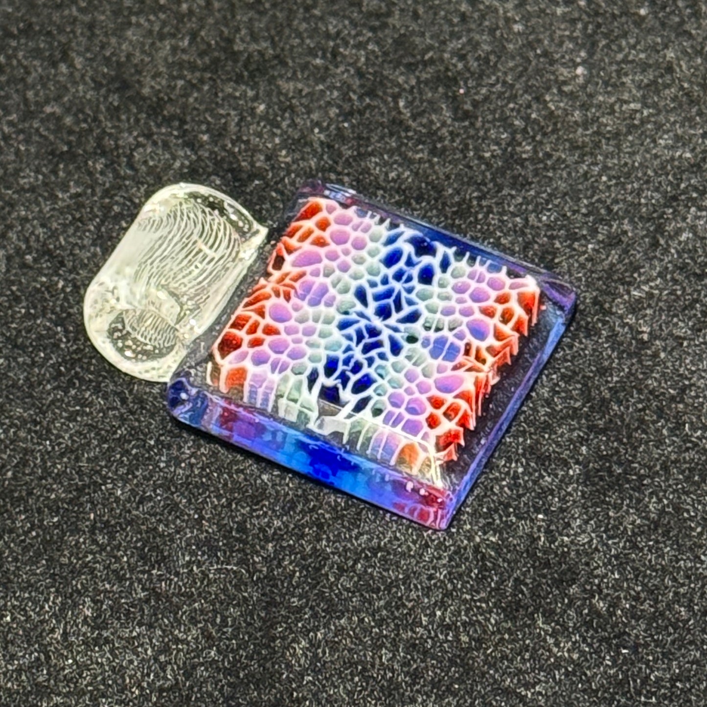 Murrine chip stack cold worked blown glass pendant with hidden UV reactive colors