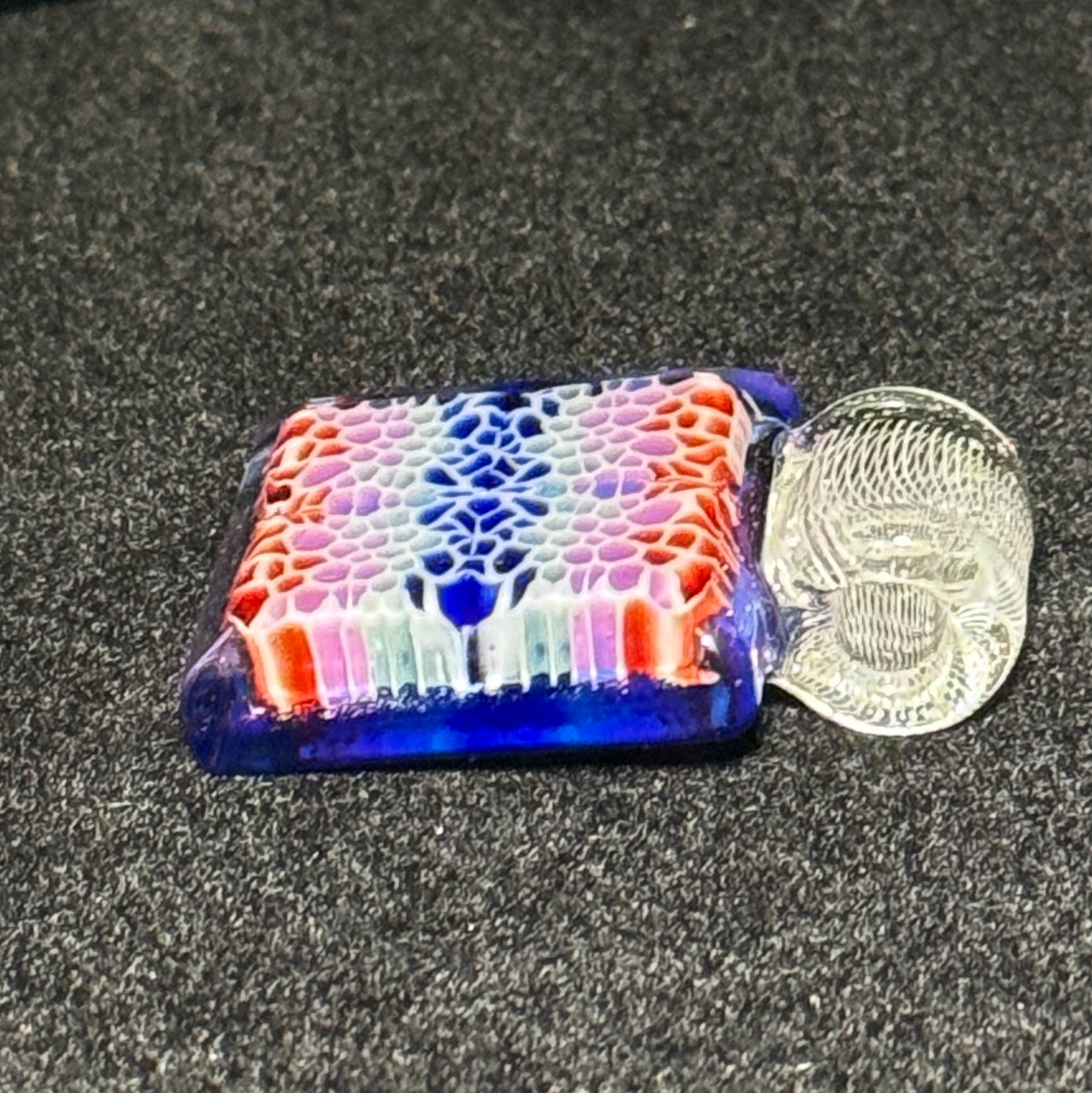 Murrine chip stack cold worked blown glass pendant with hidden UV reactive colors