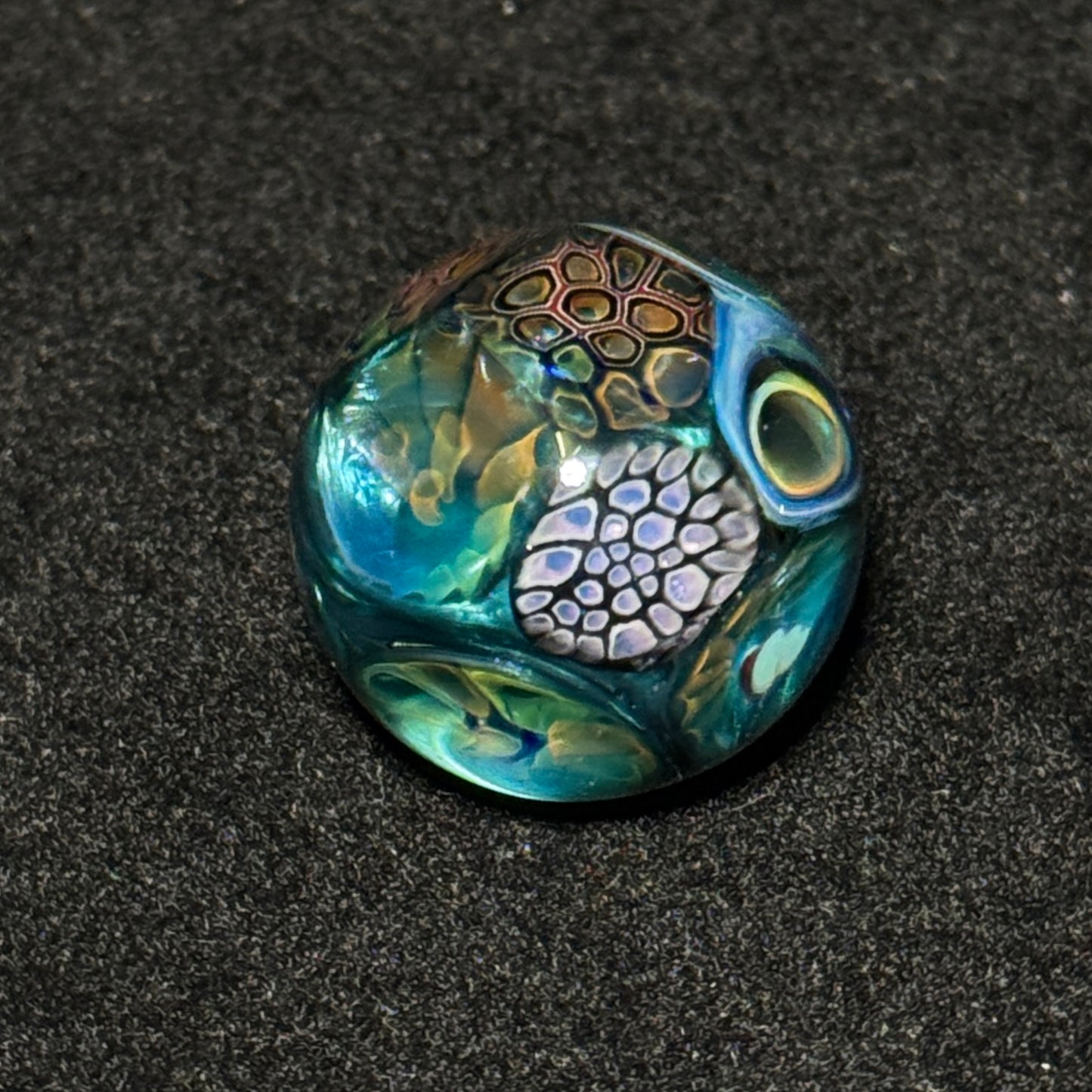 Murrine sleeve over neptunium blown glass marble, 31mm