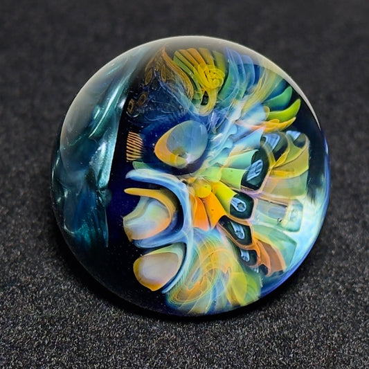 Fumescape implosion blown glass marble with neptunium swirl backing, 36mm