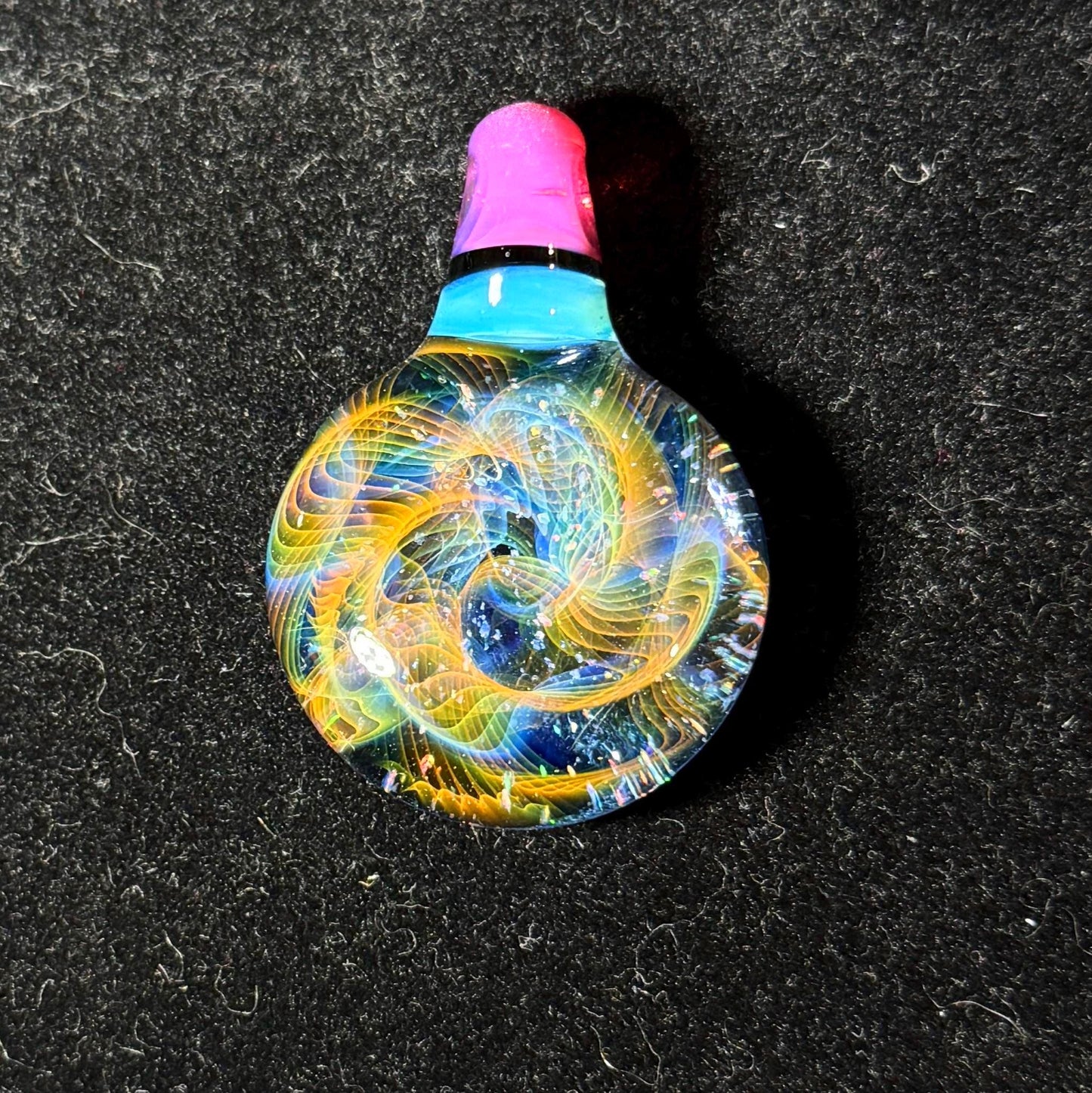 Hand blown glass pendant by Hefe Glass with karmaline pink and meta blue with gold and silver fume and crushed opal