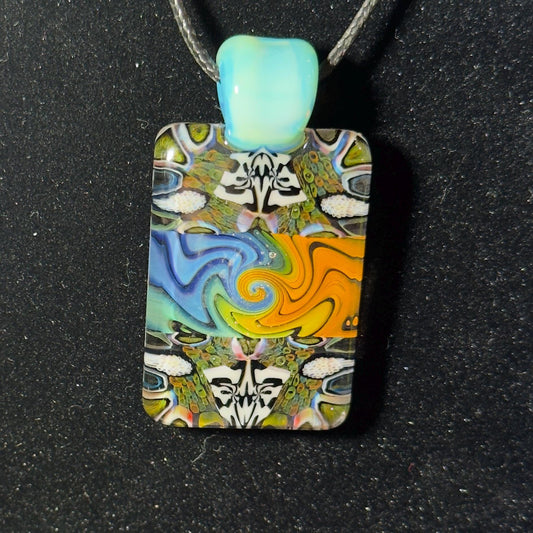 Color changing fume and murrine chip stack blown glass pendant with lucid bail