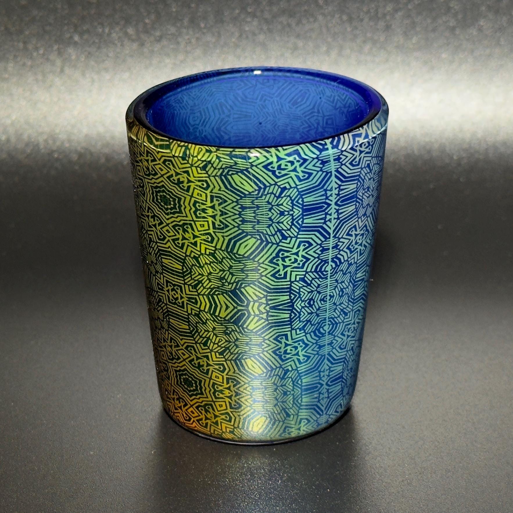 Fume pattern hand blown glass shot cup - vibrant color changing fume gradient over blue