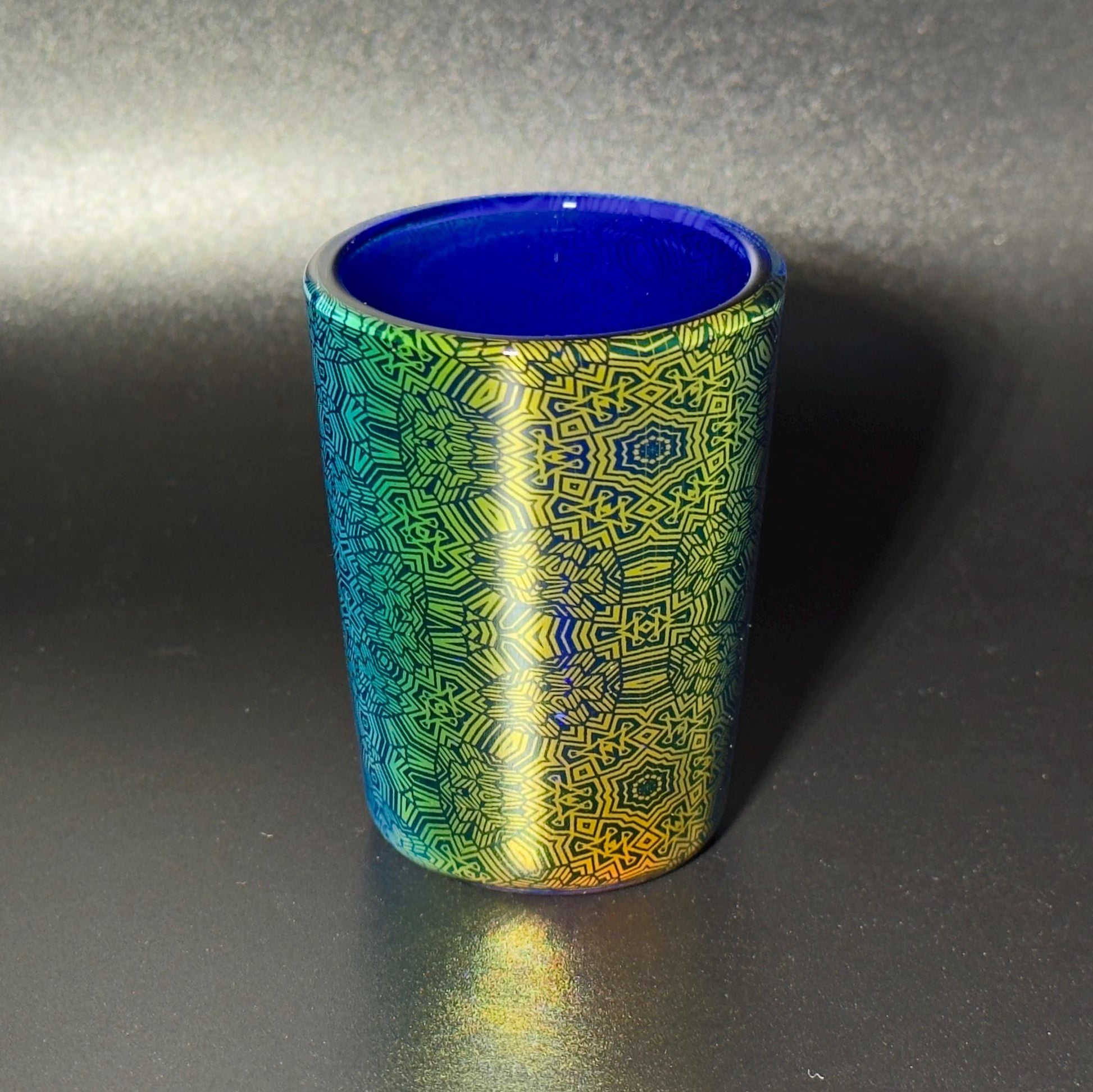 Fume pattern hand blown glass shot cup - vibrant color changing fume gradient over blue