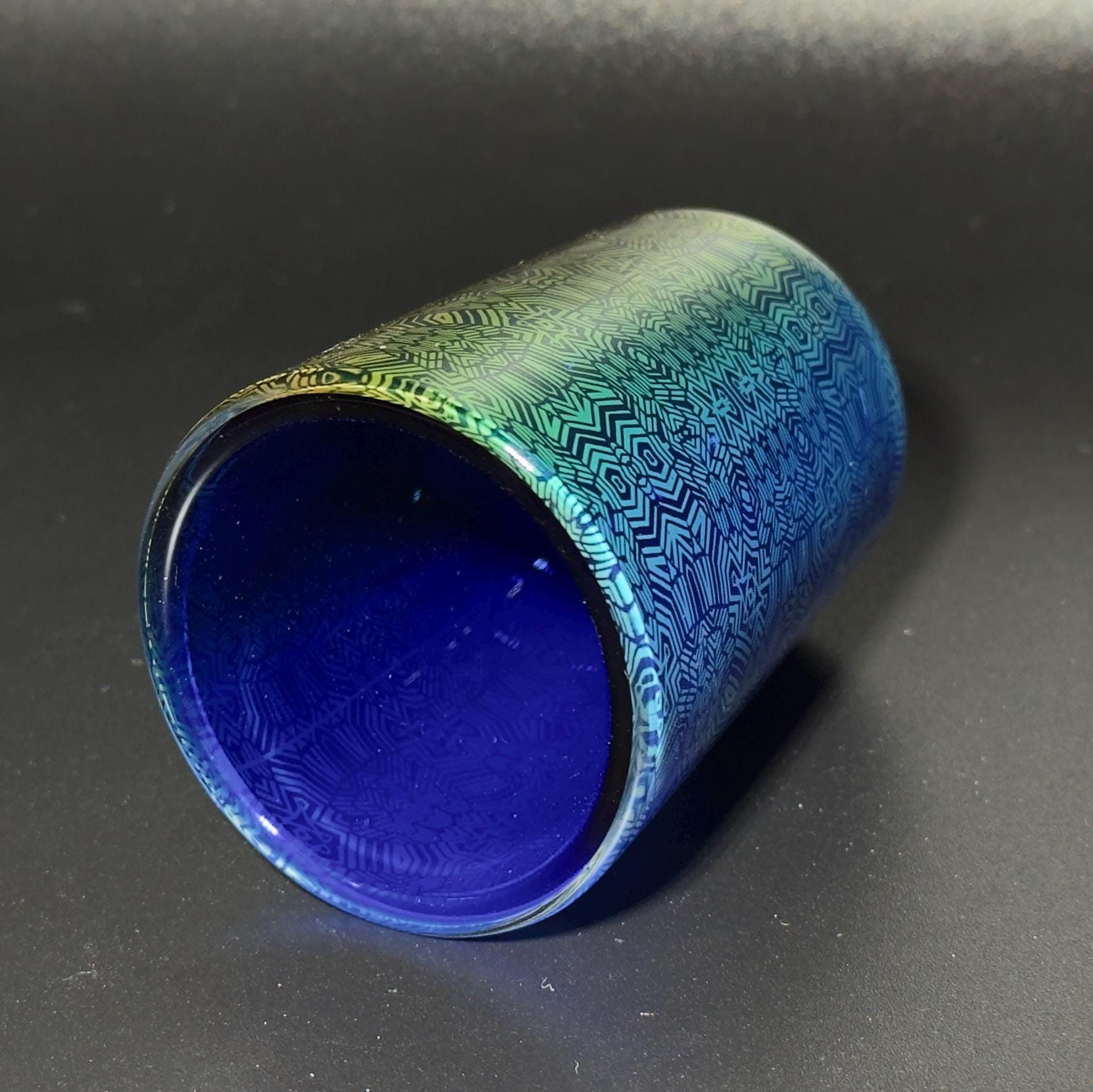 Fume pattern hand blown glass shot cup - vibrant color changing fume gradient over blue