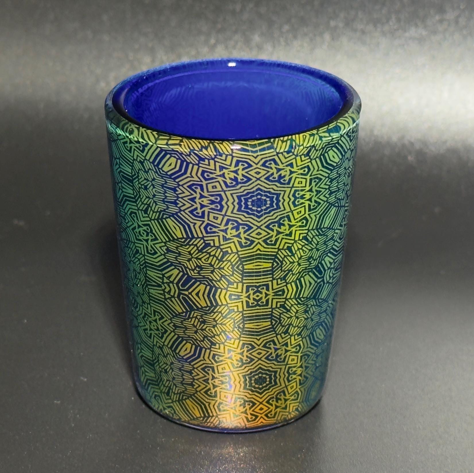 Fume pattern hand blown glass shot cup - vibrant color changing fume gradient over blue