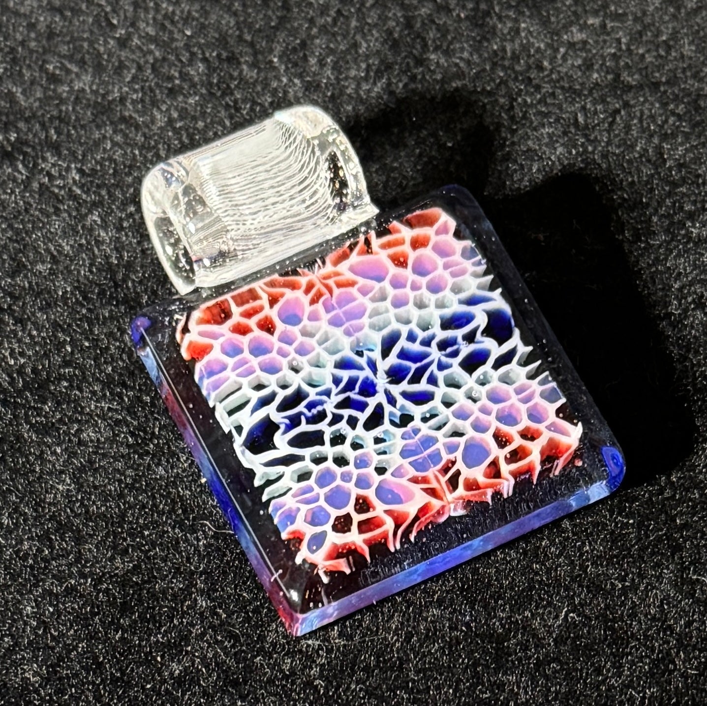 Murrine chip stack cold worked blown glass pendant with hidden UV reactive colors