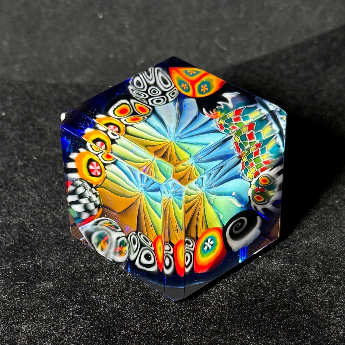 Fume murrini surround hand blown glass cube with cobalt backing