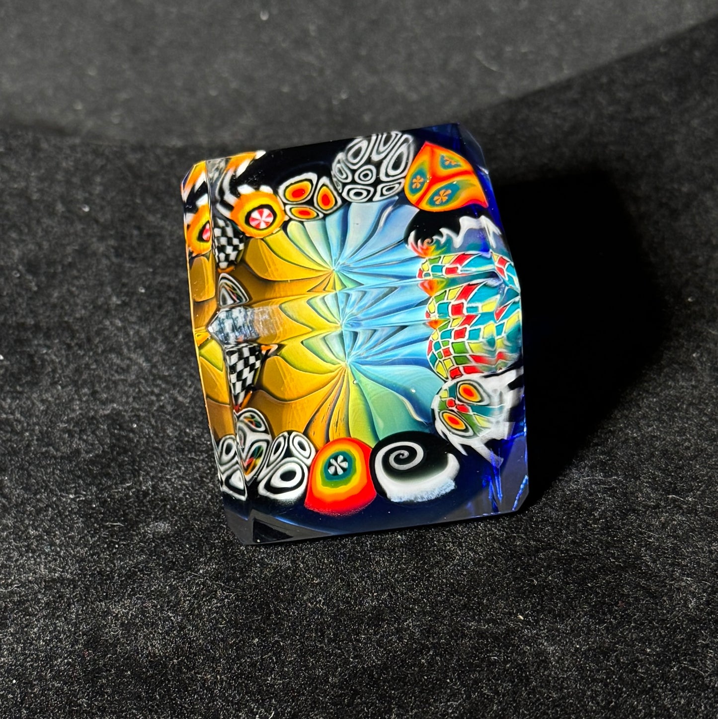 Fume murrini surround hand blown glass cube with cobalt backing