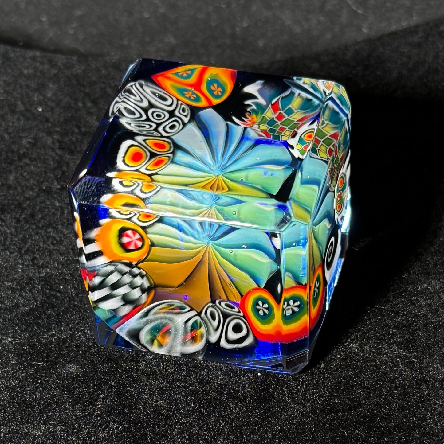 Fume murrini surround hand blown glass cube with cobalt backing