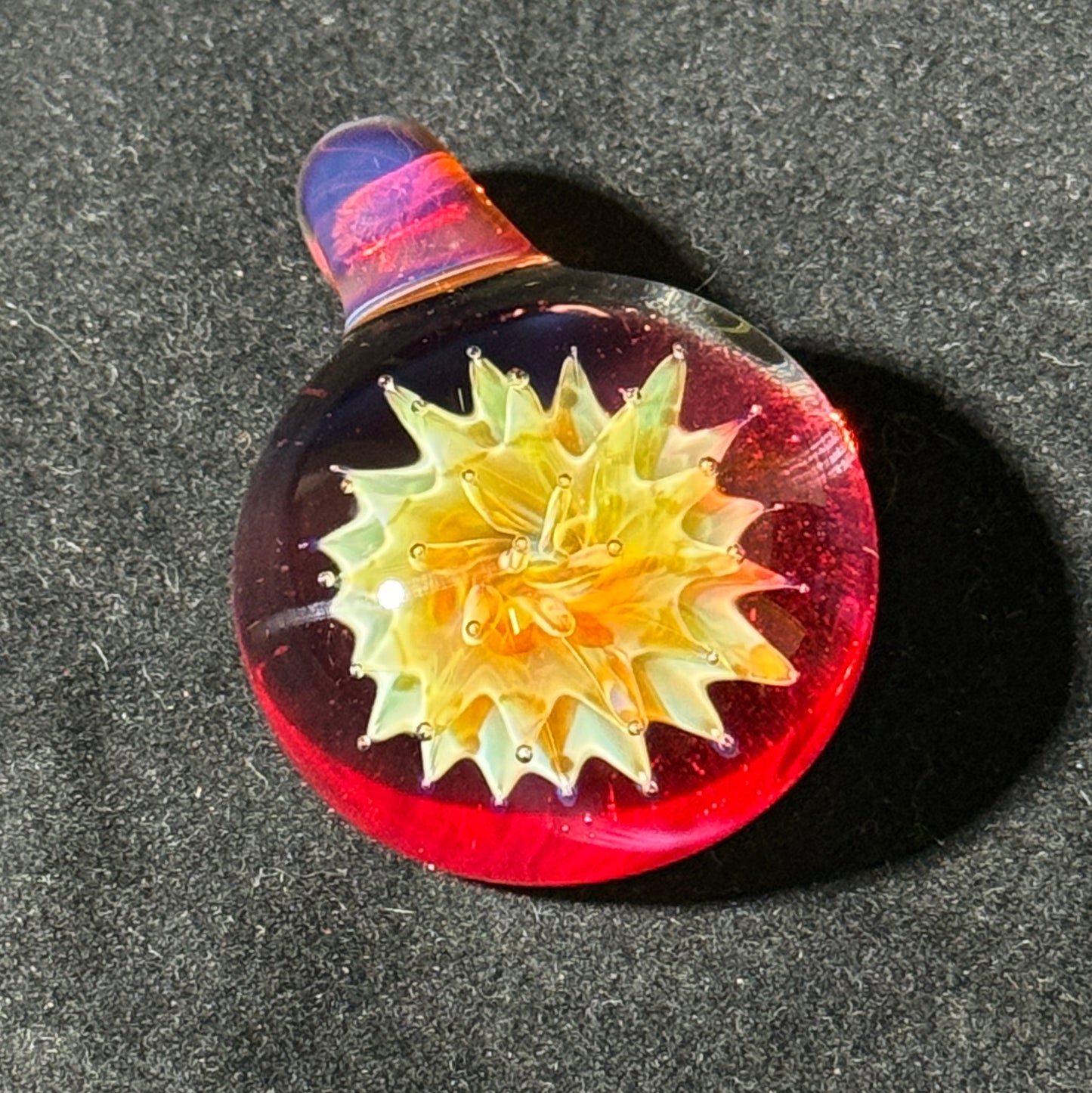 Air trap amberpurple blast implosion pendant, amberpurple bale and phoenix backing