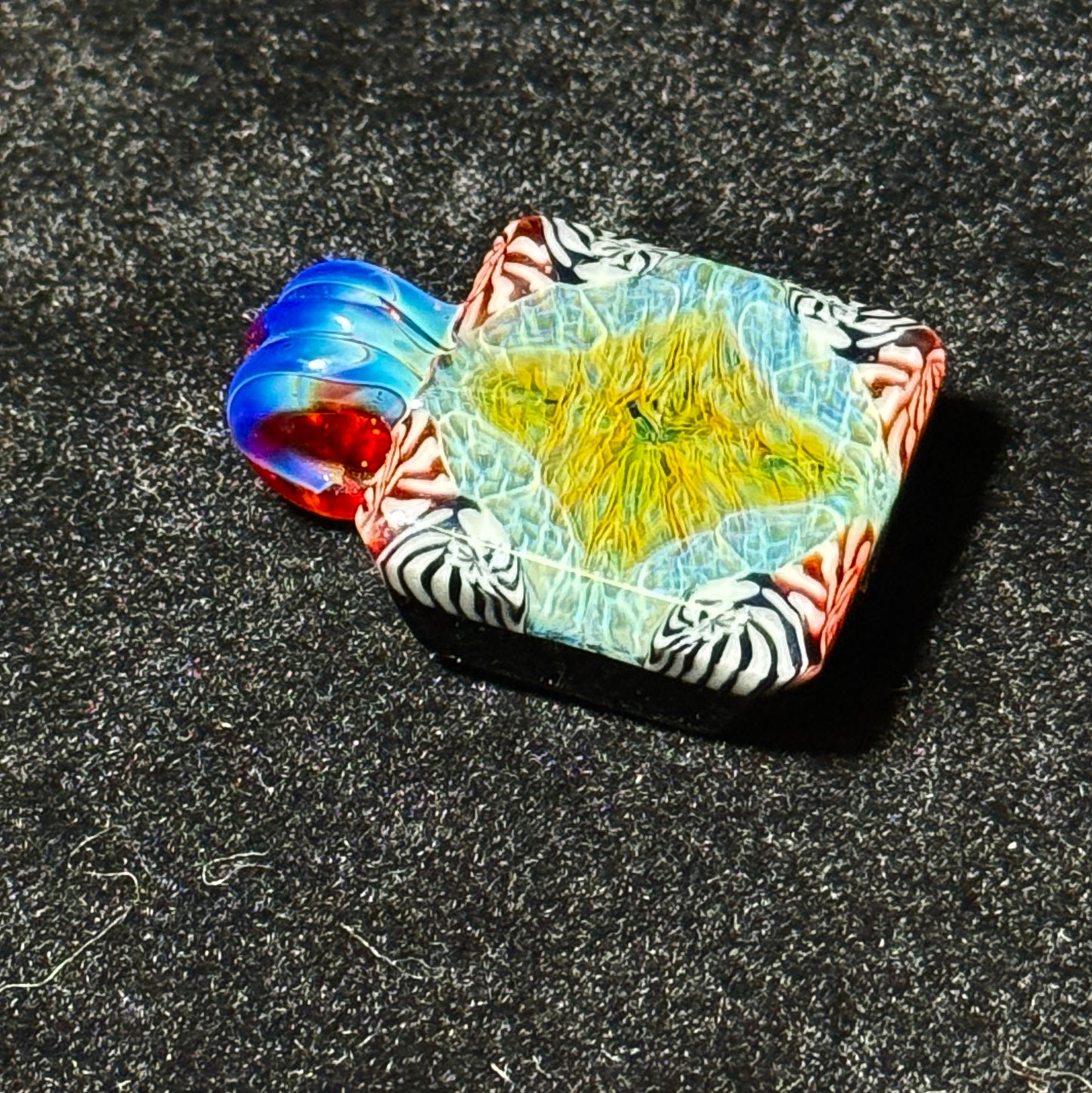 Murrine chip stack hand blown glass pendant with black backing and amber purple bale