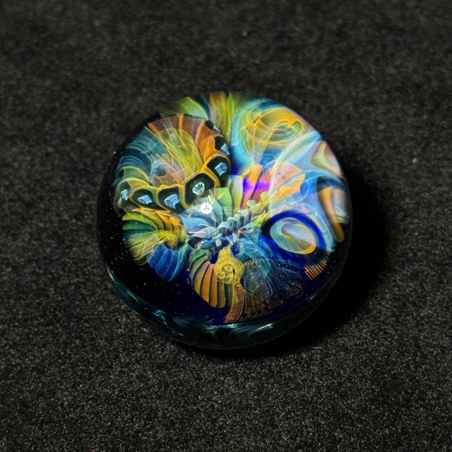 Fumescape implosion blown glass marble with neptunium swirl backing, 36mm