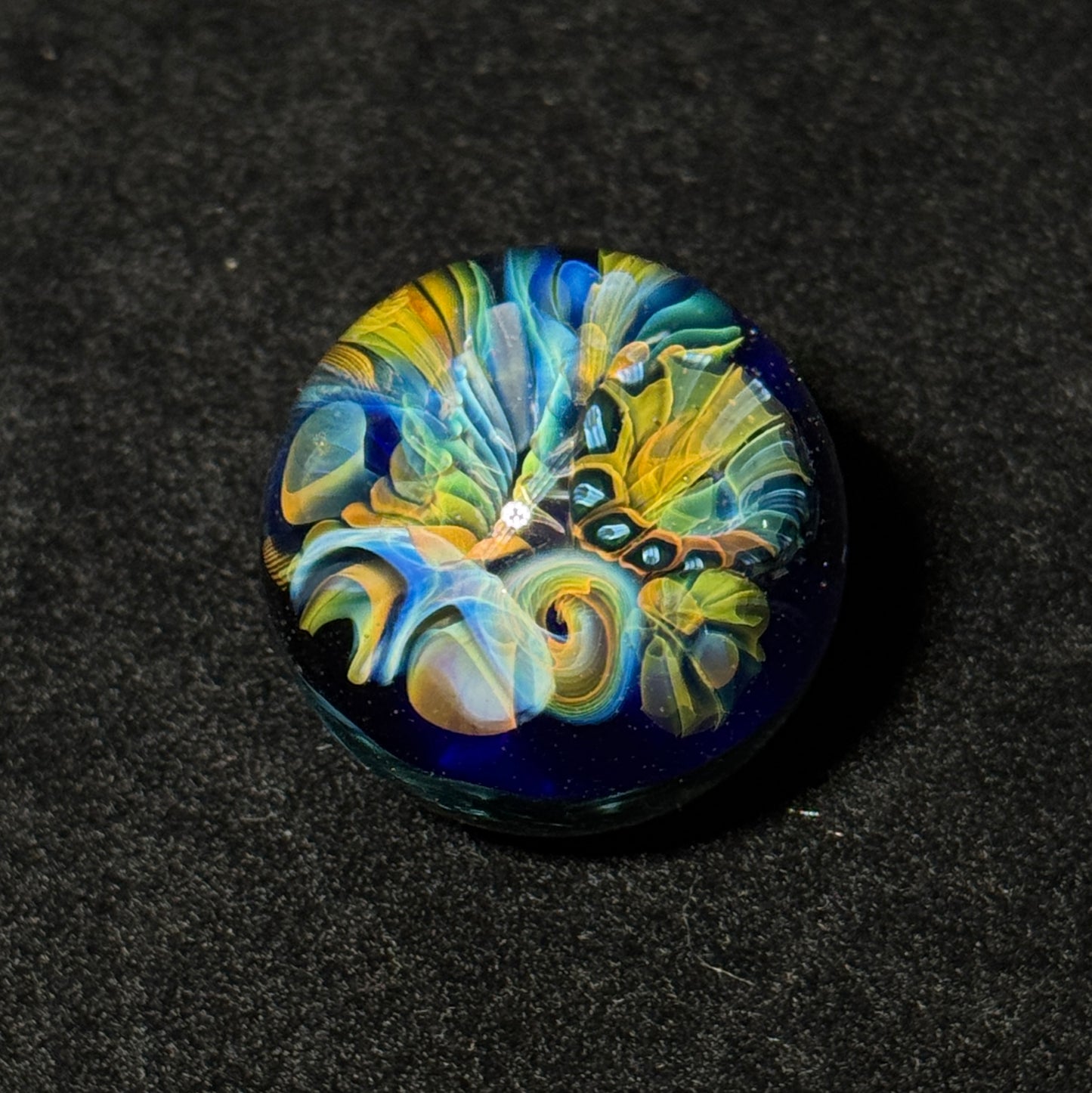 Fumescape implosion blown glass marble with neptunium swirl backing, 36mm