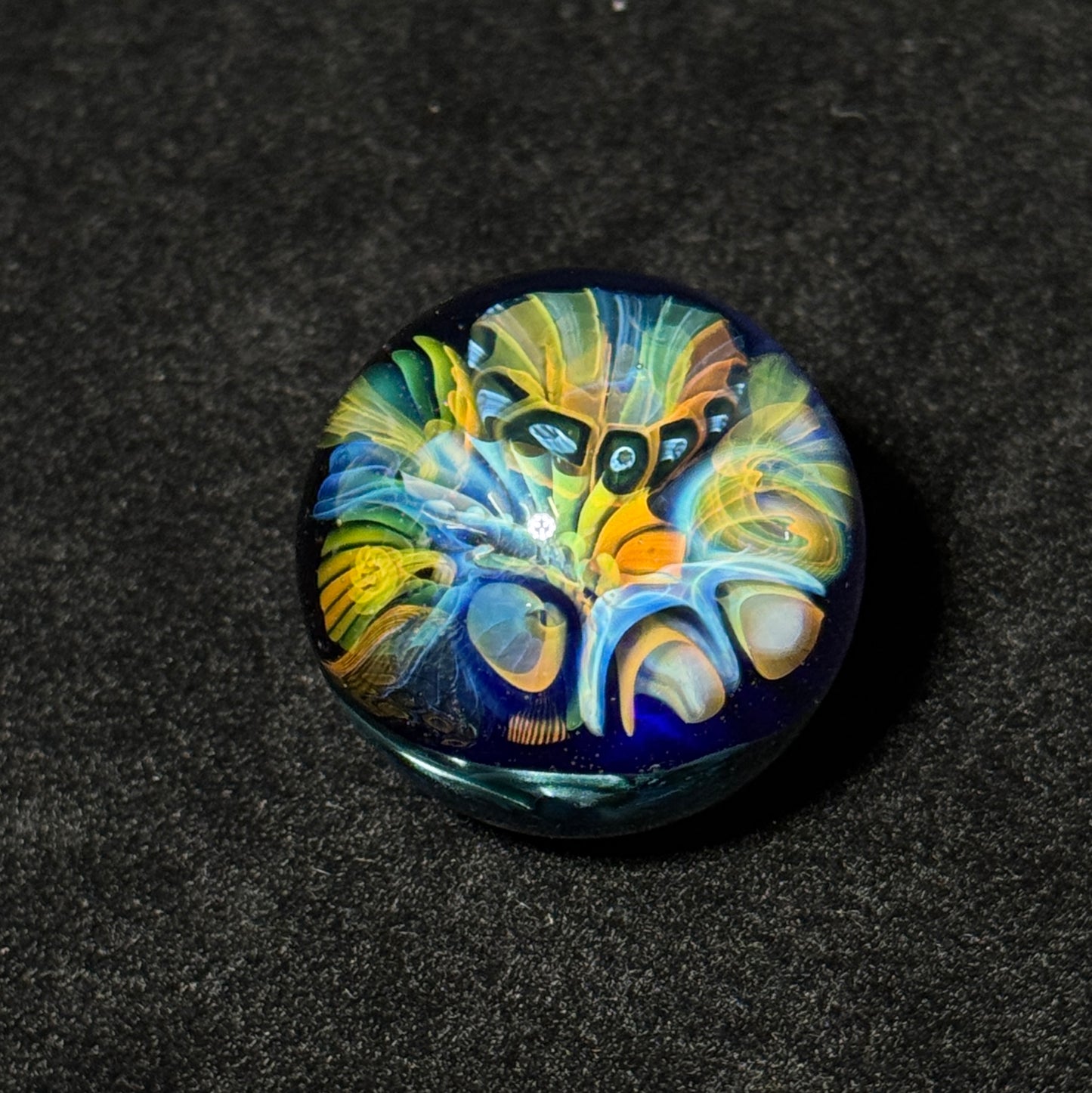 Fumescape implosion blown glass marble with neptunium swirl backing, 36mm