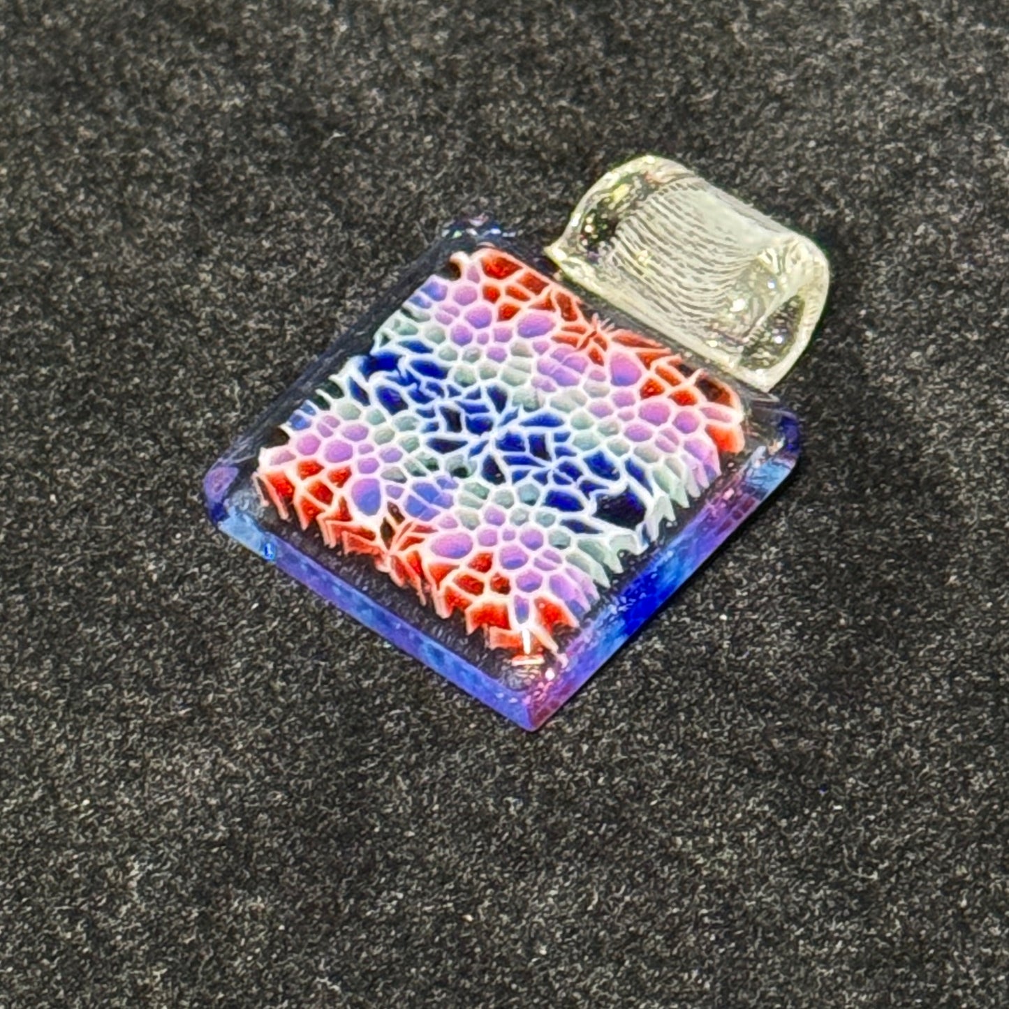Murrine chip stack cold worked blown glass pendant with hidden UV reactive colors