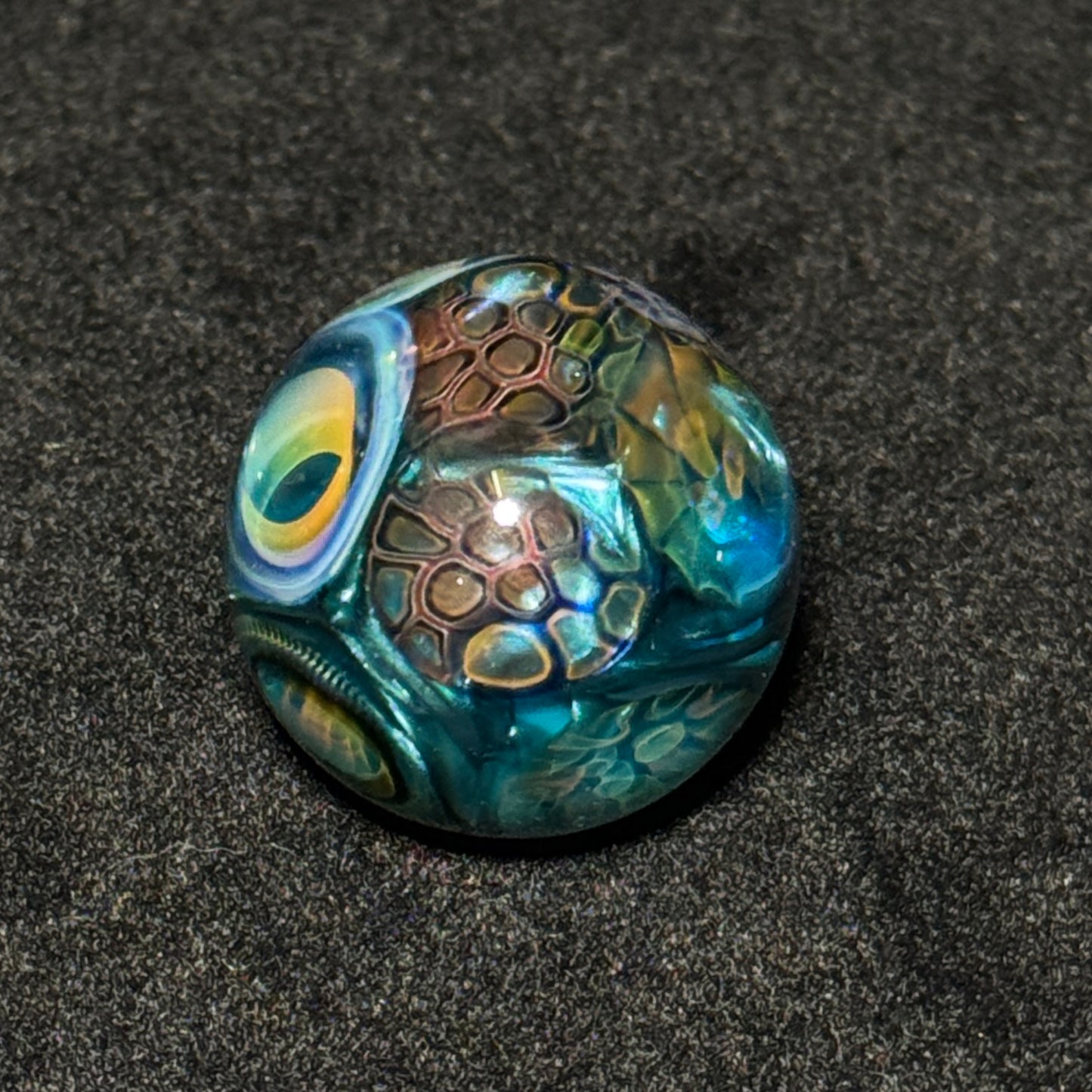 Murrine sleeve over neptunium blown glass marble, 31mm