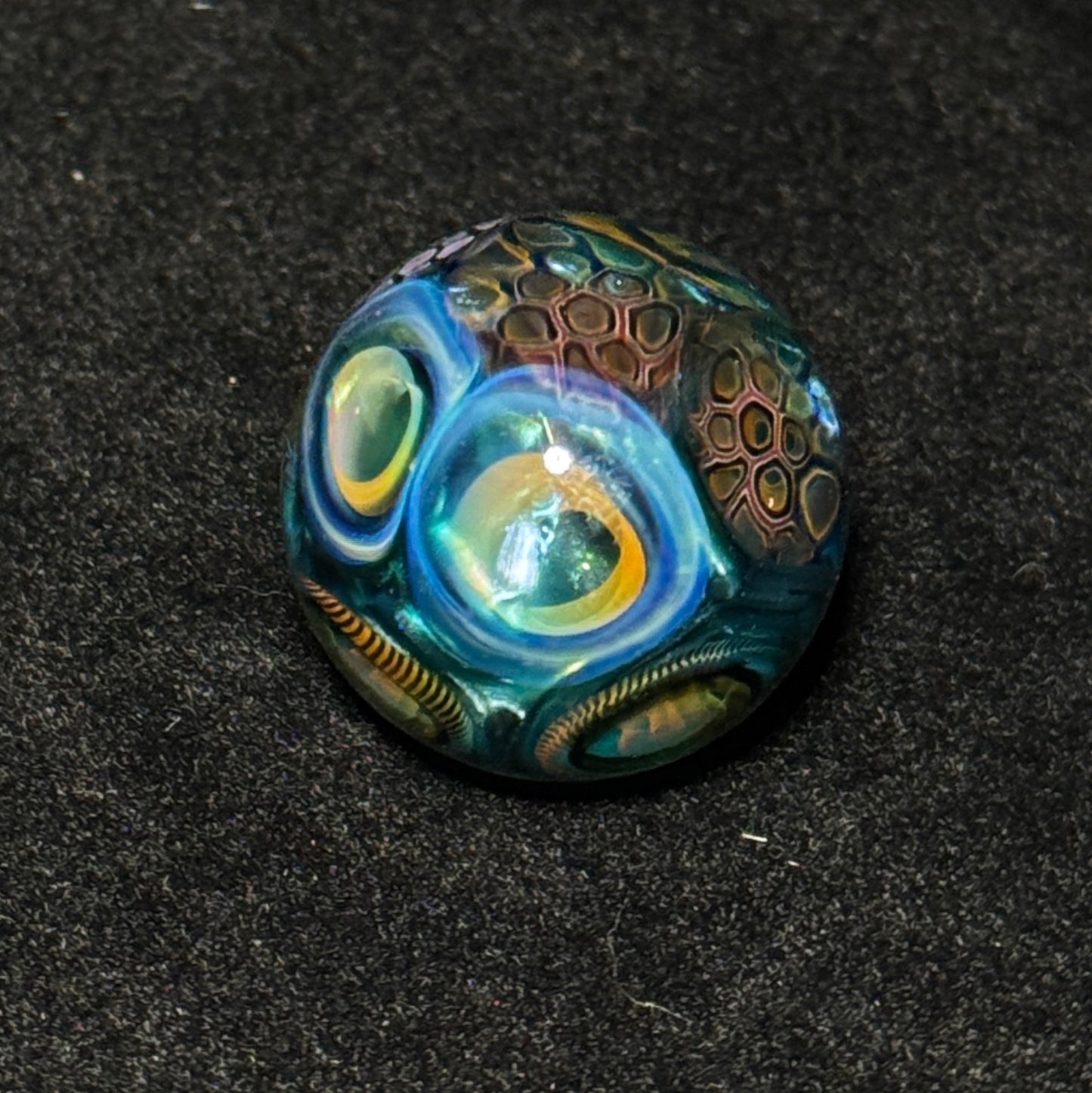 Murrine sleeve over neptunium blown glass marble, 31mm