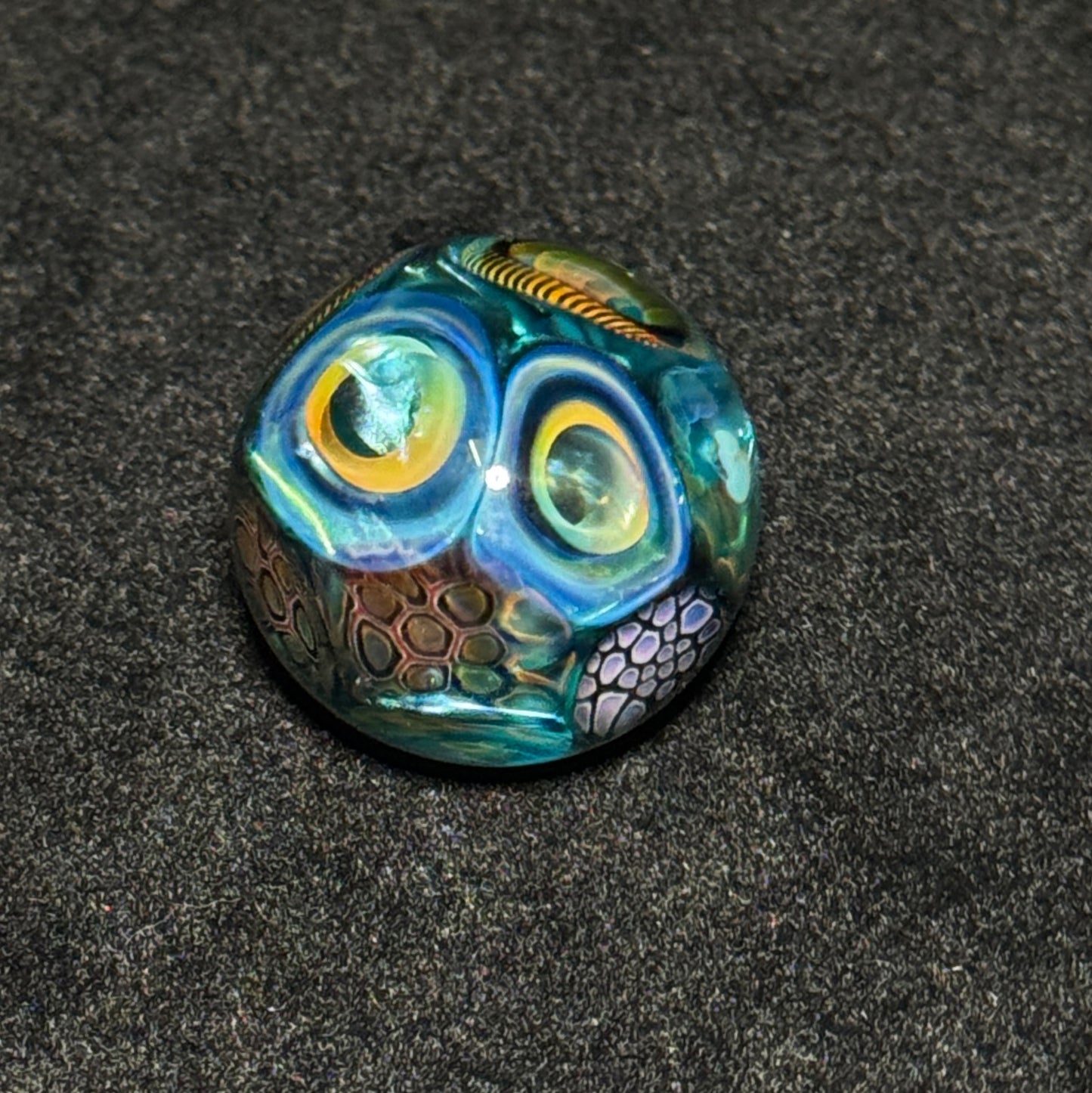 Murrine sleeve over neptunium blown glass marble, 31mm
