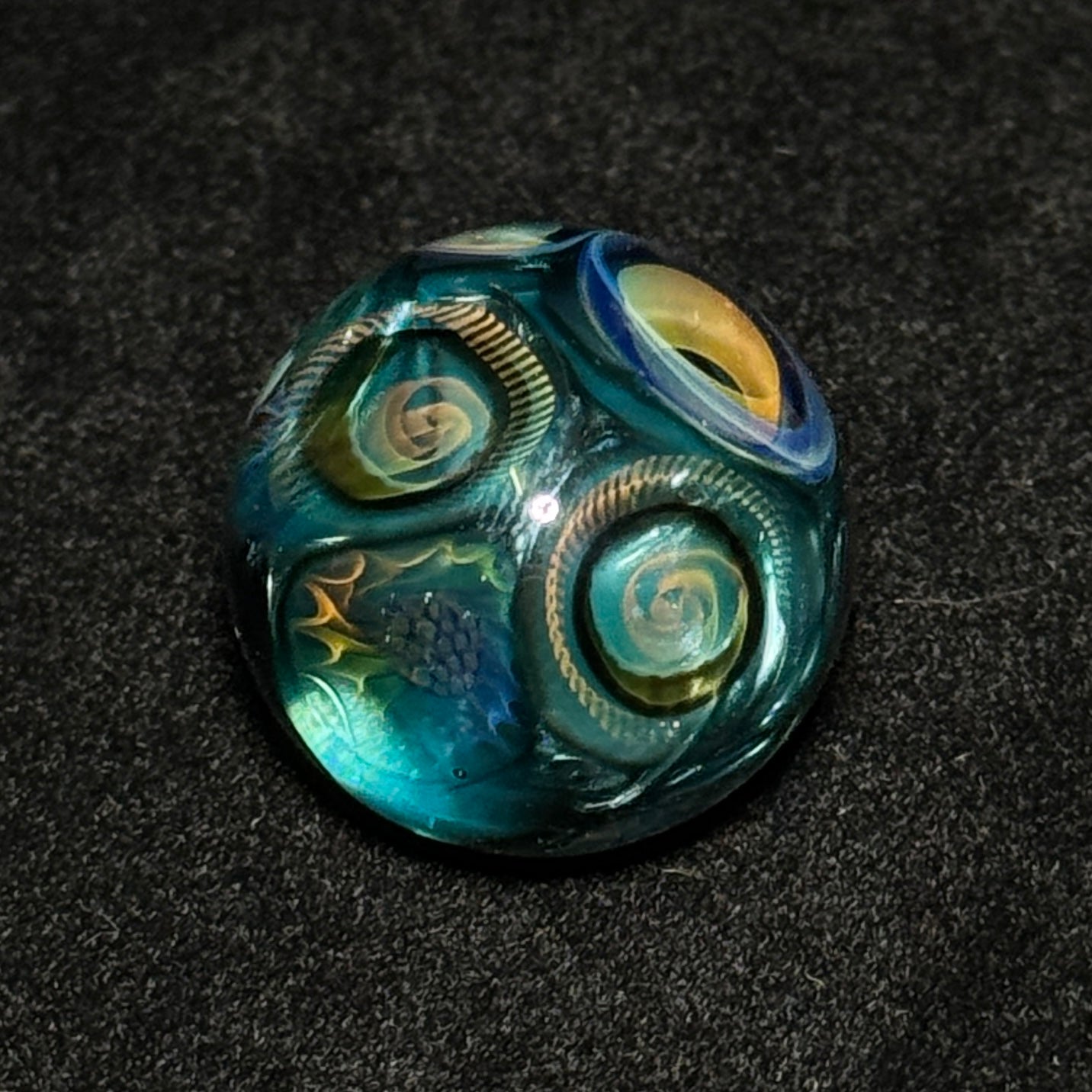 Murrine sleeve over neptunium blown glass marble, 31mm