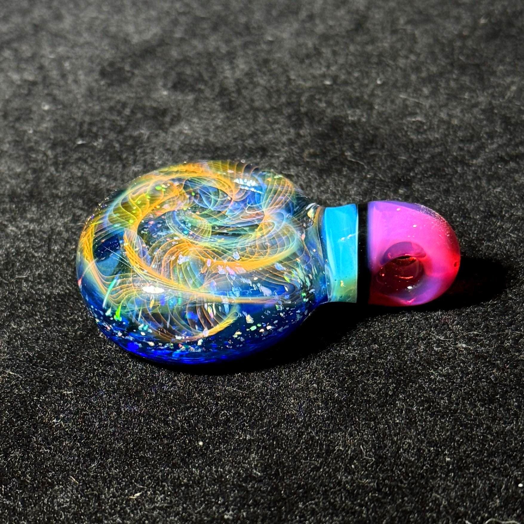 Hand blown glass pendant by Hefe Glass with karmaline pink and meta blue with gold and silver fume and crushed opal
